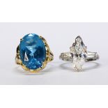 (Lot of 2) Blue topaz, cubic zirconia and 14k gold rings Including 1) oval-cut blue topaz and 14k