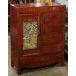 Chinese red lacquered small cabinet, with a hinged door carved with warriors of the left and a