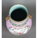 Chinese enameled porcelain vase, of hu form with reserves featuring long tail pheasants amid pink