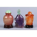 (lot of 3) Chinese stone snuff bottles: the first, carnelian high relief carved with birds and