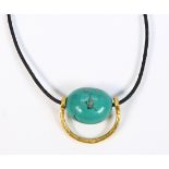 Turquoise and 14k yellow gold necklace Featuring (1) irregular turquoise bead, measuring