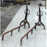 Arts and Crafts hand hammered andirons each having a floral form, 24.5"h x 40"l