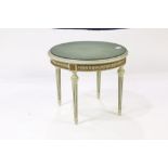Louis XVI style occasional table, the round top over a carved apron and rising on fluted tapering