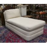 Modern day bed, having cream upholstery, 64"l