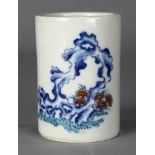 Chinese enameled porcelain brush pot, with red enameled lingzhi amid underglaze blue garden rock,