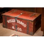 Decorative Wells Fargo and Co., treasure strong box, having a crimson exterior with metal