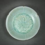 Chinese qingbai glazed ceramic dish, with a foliate rim and molded petal form walls framing the well