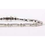 Diamond and 14k white gold bracelet Featuring (14) full-cut diamonds, weighing a total of