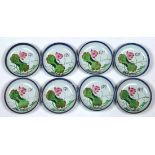 (lot of 8) Chinese enameled porcelain plates, featuring a pink lotus blossom, beside a colophon, the