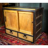 Japanese tansu chest, large sliding door section with a half shelf interior, above two drawers, iron