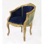 (lot of 2) Louis XV style giltwood bergere, having a shaped back, above blue upholstery, accented