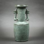 Chinese Guan type ceramic vase, with a dish rim and cylindrical body flanked by stylized handles,