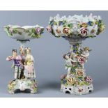 (lot of 2) Continental porcelain figural group, consisting of (2) compotes, the larger, having