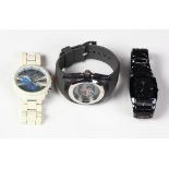 (Lot of 3) Metal and rubber wristwatches Including 1) metal and rubber wristwatch; 1) rubberized