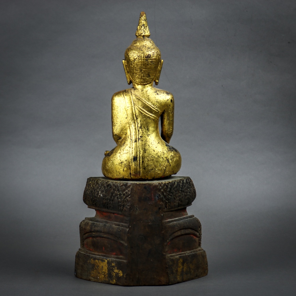 Southeast Asian gilt wood Buddha, seated in bhumispharsha mudra, on a tiered splayed pedestal, 13. - Image 3 of 4