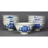 (lot of 9) Chinese underglazed blue porcelain cups, decorated with floral sprays, below the rim