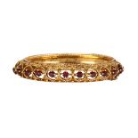 Garnet and 14k yellow gold bracelet Featuring (11) round-cut garnets, weighing a total of 2.75 cts.,