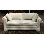 Pair of contemporary striped sofas, each having loose cushions with fabric wrapped base, 25"h x 69"w
