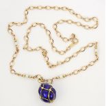 Diamond, cultured pearl, and 14k yellow gold pendant-necklace Designed as a quilted egg, measuring