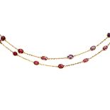 Spinel and 18k yellow gold necklace Featuring (44) oval and pear-shaped spinels, weighing a total of