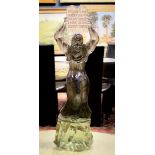 Art glass sculpture depicting Moses raising the Ten Commandments over his head, his body in smoke