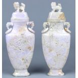 Pair of Chinese jadeite urns, the flared neck flanked by zoomorphic handles suspending loose