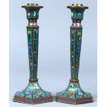 (lot of 2) Chinese cloisonne enameled candle holders, the tapering hexagonal shaft with floral