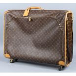 Louis Vuitton soft shell suitcase, having brown canvas monogram, with a zipper on front, and