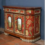 Mackenzie Childs hand painted chest, having a crimson case with panelled doors, each having