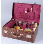 English crystal and sterling vanity set, housed in a fitted case, the assembled set marked with