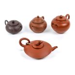 (lot of 4) Chinese zisha ceramic teapots: one with reserve of bat and coins, raised on three short