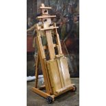 (lot of 2) Wood easels, one having wheels, tallest 57.5"h