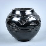 Santa Clara or San Ildefonso blackware vessel, having relief carved arrow motifs, signed