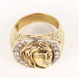 Diamond and 14k yellow gold ring Designed with a face in relief, accented by (13) full-cut diamonds,