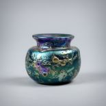 In the manner of Tiffany Studios "Cypriote" vase, having a Classical style tapered form executed