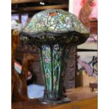 Tiffany style mosaic and leaded glass table lamp, having a domed shade with spider web accents,