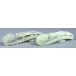 (lot of 2) Chinese celadon jade belt hooks, each of dragon form with a meandering chilong on the
