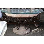 Moderne stone console table, having a patinated metal base, with scrolled accents, and having a