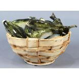 Gerry Wallace ceramic sculpture depicting fish in a woven basket, signed on underside, 8.5"h x 13.