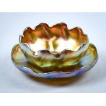 (lot of 2) Tiffany Studios iridescent favrile glass bowl with under tray, the bowl having a ruffle