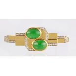 Jadeite, diamond and 18k yellow gold brooch Featuring (2) jadeite cabochons, measuring approximately