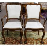 Pair of Chippendale style arm chairs, each having a shield form back with nail head trim, and rising