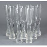 (lot of 9) Contemporary crystal champagne flutes, having a clear bowl rising on the frosted and