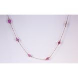 Pink sapphire, sterling silver gilt necklace Featuring (22) irregular pink sapphire slices,