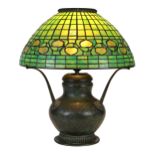 Tiffany Studios New York leaded glass table lamp, the geometric decorated 16" shade centered with