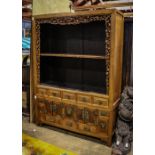 Chinese two-section wood cabinet, the upper portion with two open shelves framed by pierced gourd