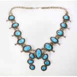 Native American turquoise, silver squash blossom necklace Centering a naja, featuring (7)