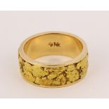 Natural gold nugget and 14k yellow gold band Featuring several natural gold nuggets, inset into an