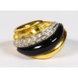 Black onyx, diamond, 18k yellow and white gold ring Featuring (1) diagonal black onyx wedge,