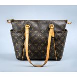 Louis Vuitton handbag, having brown monogram canvas, with top zipper and side handles, 10"h